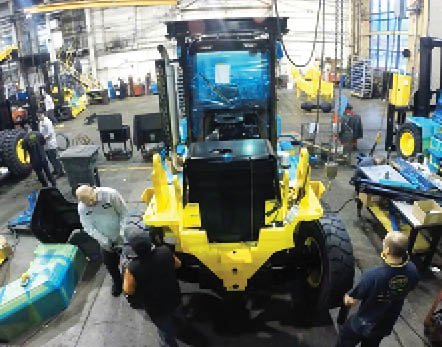 Workers assemble a new Hoist Lift Truck in East Chicago. Moving to Indiana from Illinois saved the company $1 million annually in workers’ compensation-related costs according to Hoist CEO, Marty Flaska.