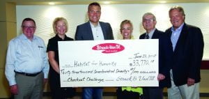 Strack & Van Til check to Habitat for Humanity