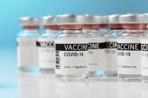 ampoules with Covid-19 vaccine on a laboratory bench. to fight the coronavirus / sars-cov-2 pandemic.