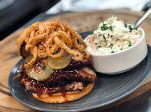 The pulled pork and coleslaw served at The Farmhouse Restaurant make the most of ingredients from Fair Oaks Farm and neighboring farms.