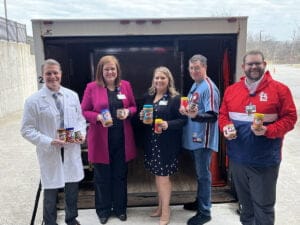 Members of the Northwest Health – Porter administrative team (left to right) Dr. James Leonard, Ashley
Dickinson, Sarah Hunter, Mike Johnson and Derrick Naegler help load the van with peanut butter jars.